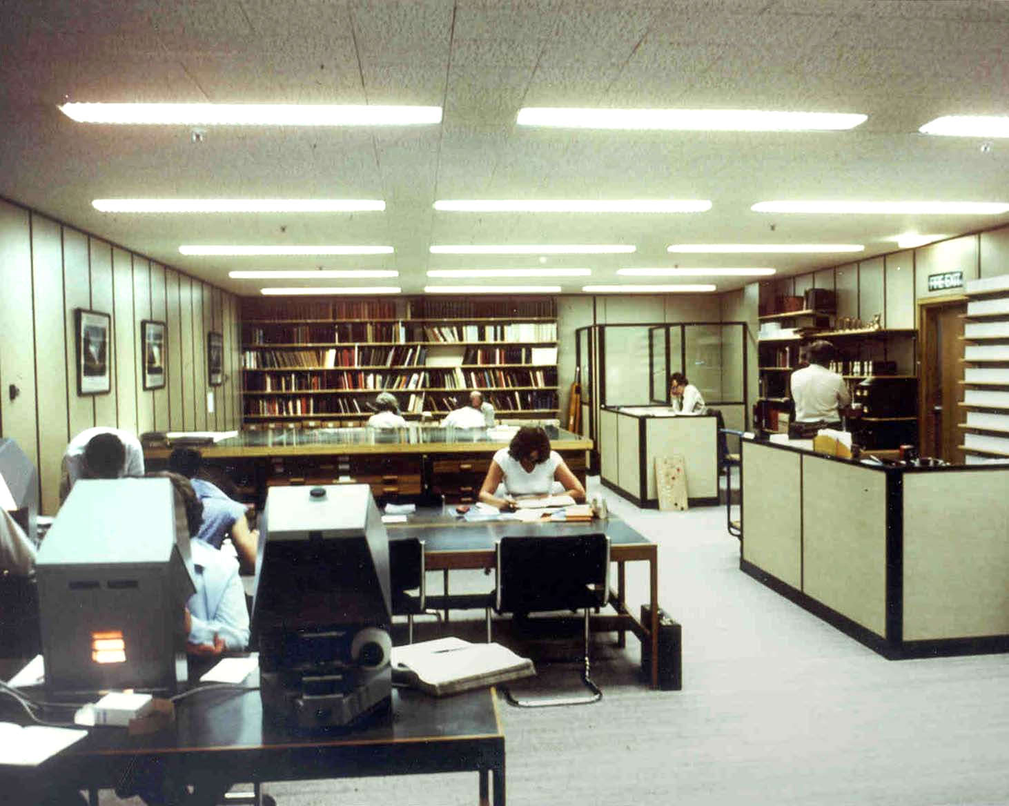 Shire Hall searchroom of the Royal Berkshire Archive 1980s with people sat at desks.
